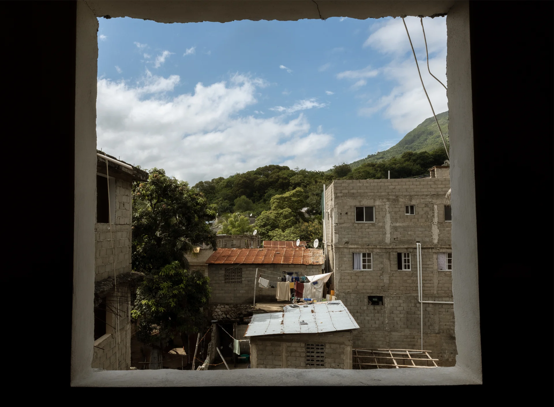 Mountainside in Haiti through the window at a school building in Cap Haitien