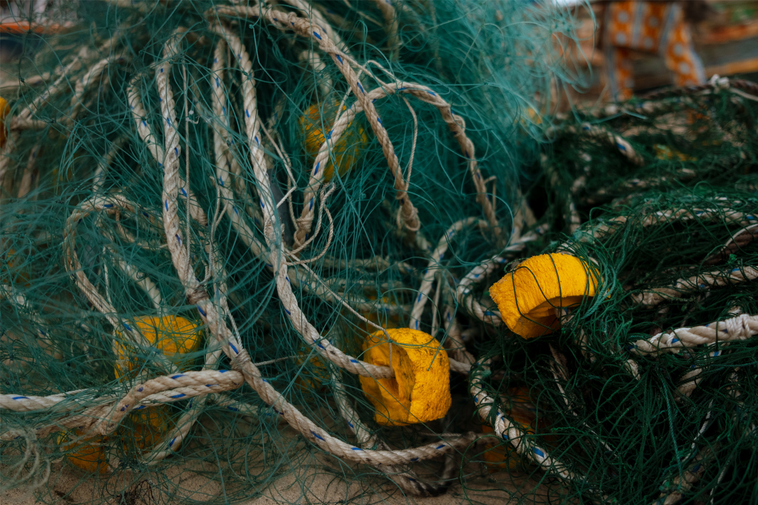 A fishing net sits on top of the sand in Oakam, Senegal. 